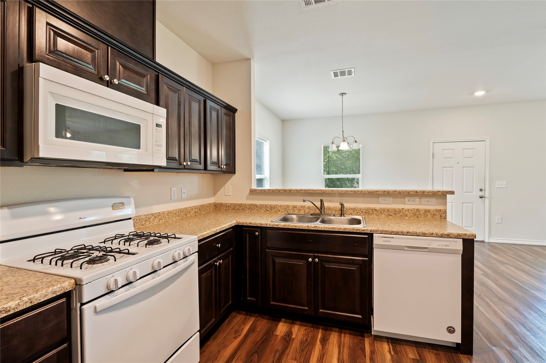 1125 Lake Road La Marque, TX 77568 - Photo 11 of 33 a kitchen with stainless steel appliances a stove sink and microwave