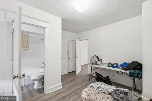 a workspace with furniture and a wooden floor