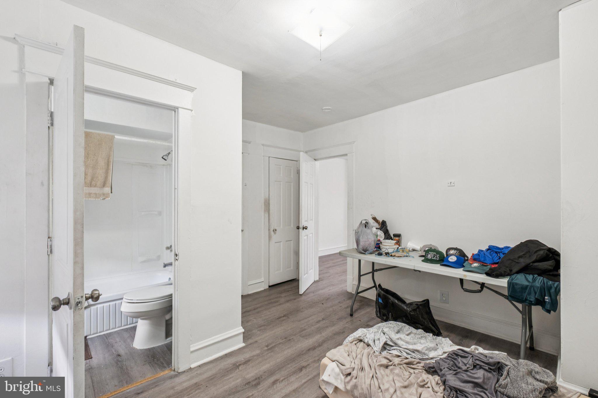 235 Ashby Road Upper Darby, PA 19082 - Photo 12 of 30 a workspace with furniture and a wooden floor