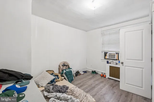 a bed room with a bed and a window