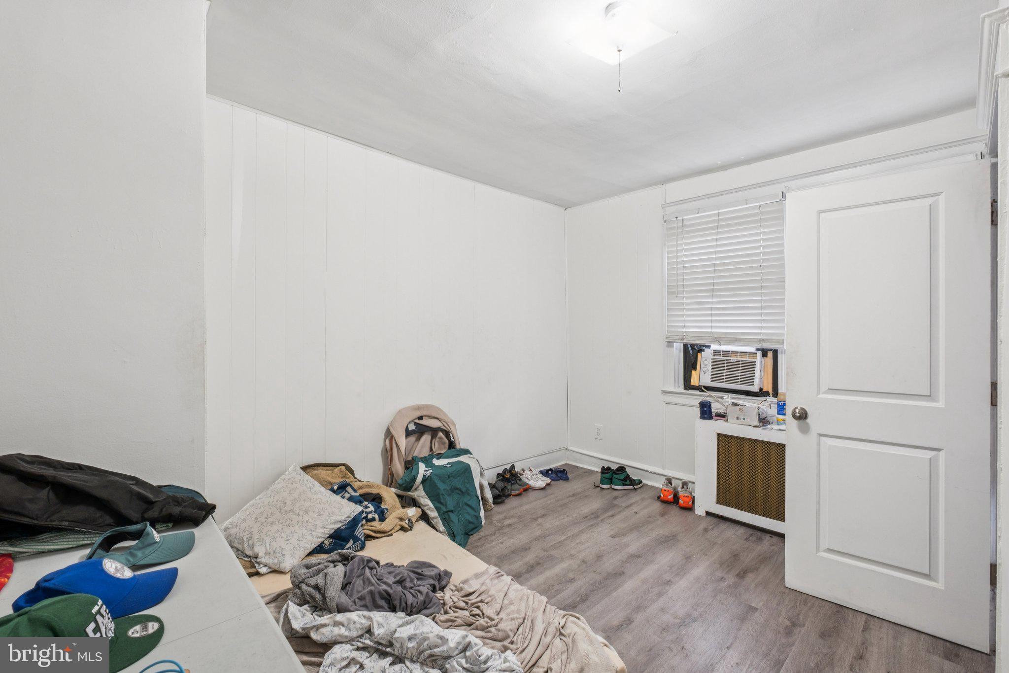 235 Ashby Road Upper Darby, PA 19082 - Photo 13 of 30 a bed room with a bed and a window