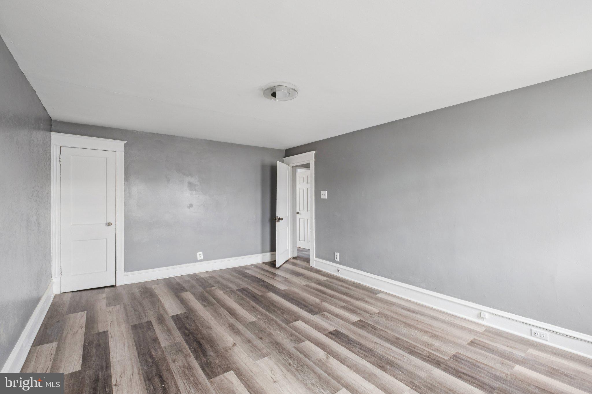 235 Ashby Road Upper Darby, PA 19082 - Photo 14 of 30 a view of room with wooden floor