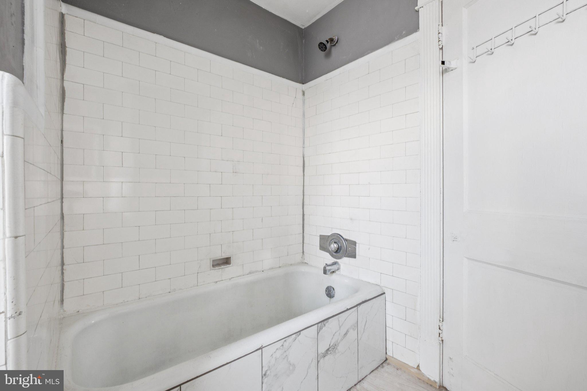235 Ashby Road Upper Darby, PA 19082 - Photo 26 of 30 a bathroom with a bathtub and shower