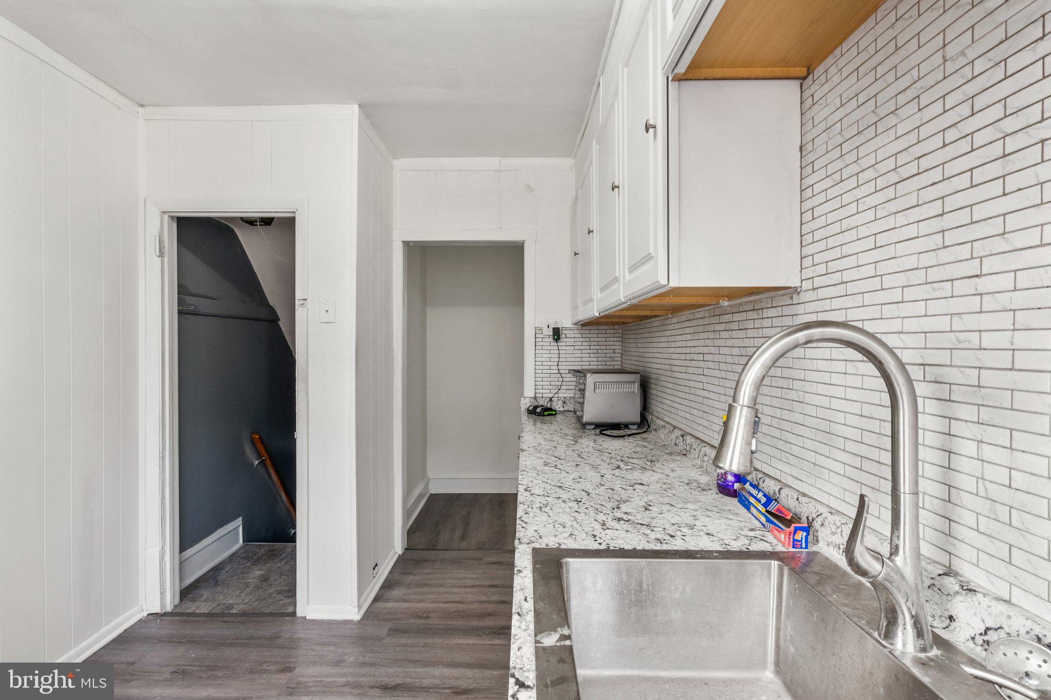 235 Ashby Road Upper Darby, PA 19082 - Photo 6 of 30 a kitchen with stainless steel appliances granite countertop a refrigerator and a stove