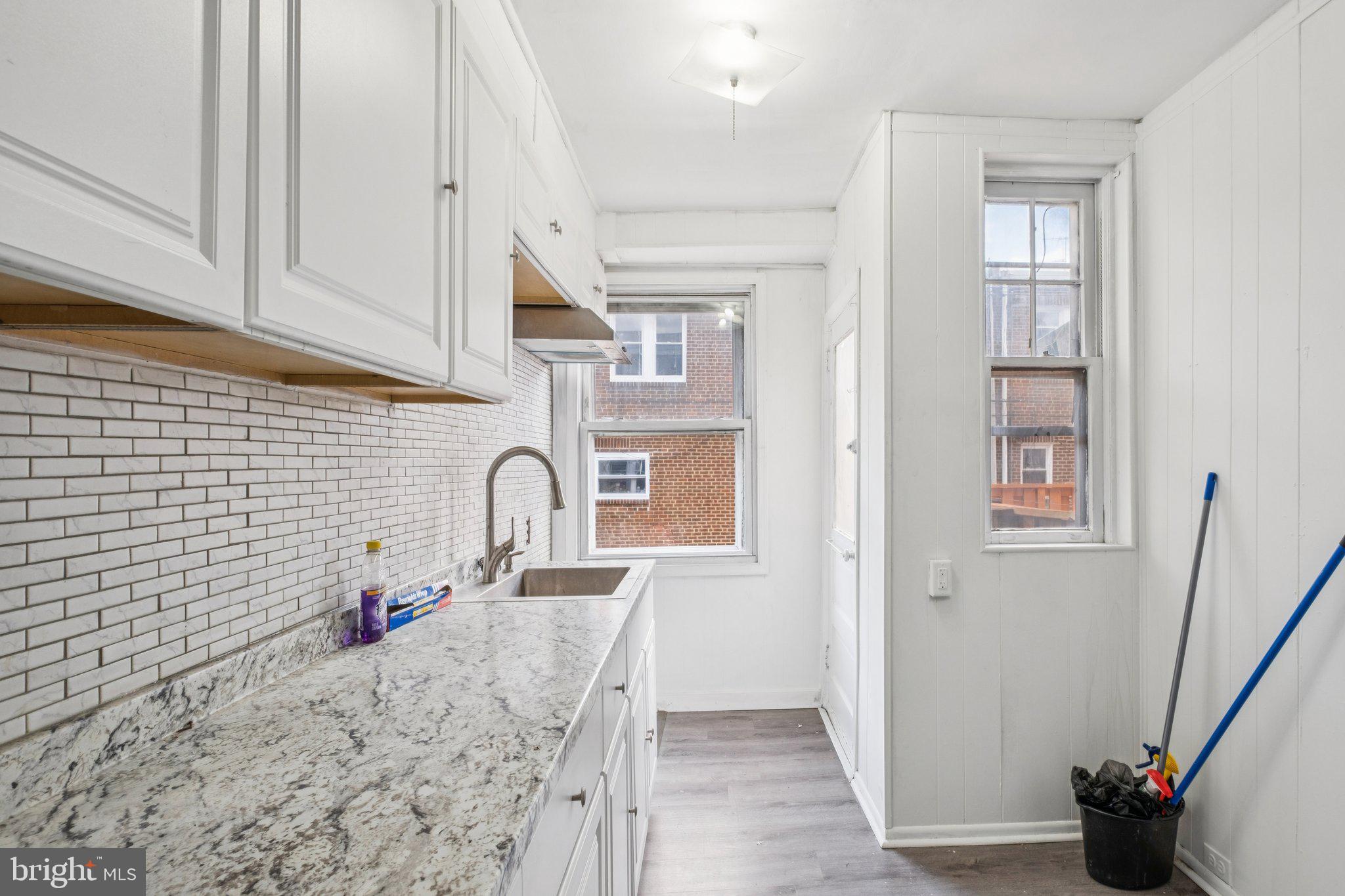 235 Ashby Road Upper Darby, PA 19082 - Photo 7 of 30 a bathroom with a sink and a mirror
