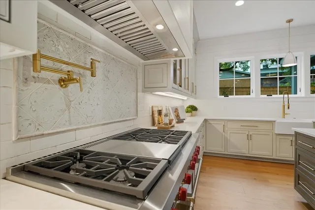 a kitchen with a table and chairs