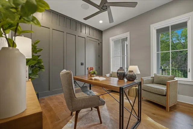 a bathroom with a sink a toilet a mirror and shower