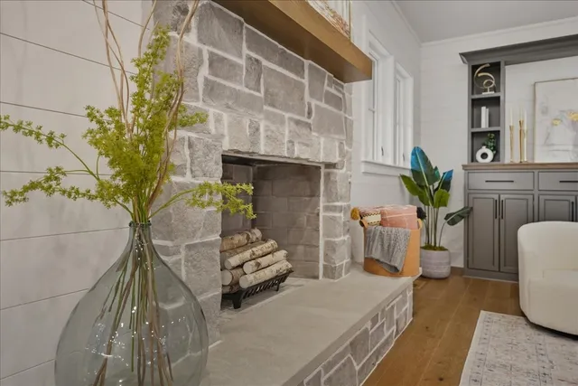 a bathroom with a granite countertop sink a toilet and shower
