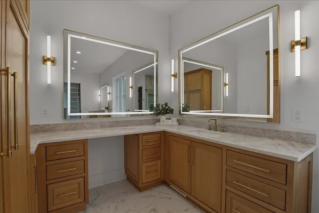 a view of a kitchen with a sink and dishwasher with wooden floor