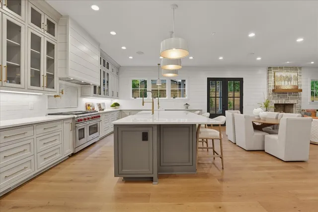 a stove top oven sitting inside of a kitchen