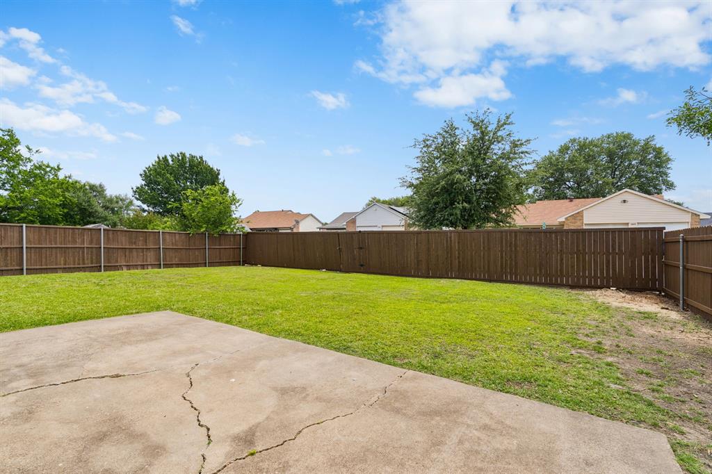 5620 Perrin Street The Colony, TX 75056 - Photo 23 of 31 a view of backyard with wooden fence