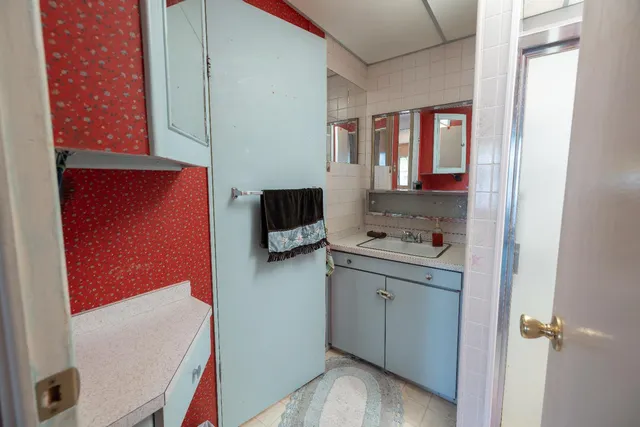 a bathroom with a sink and a mirror
