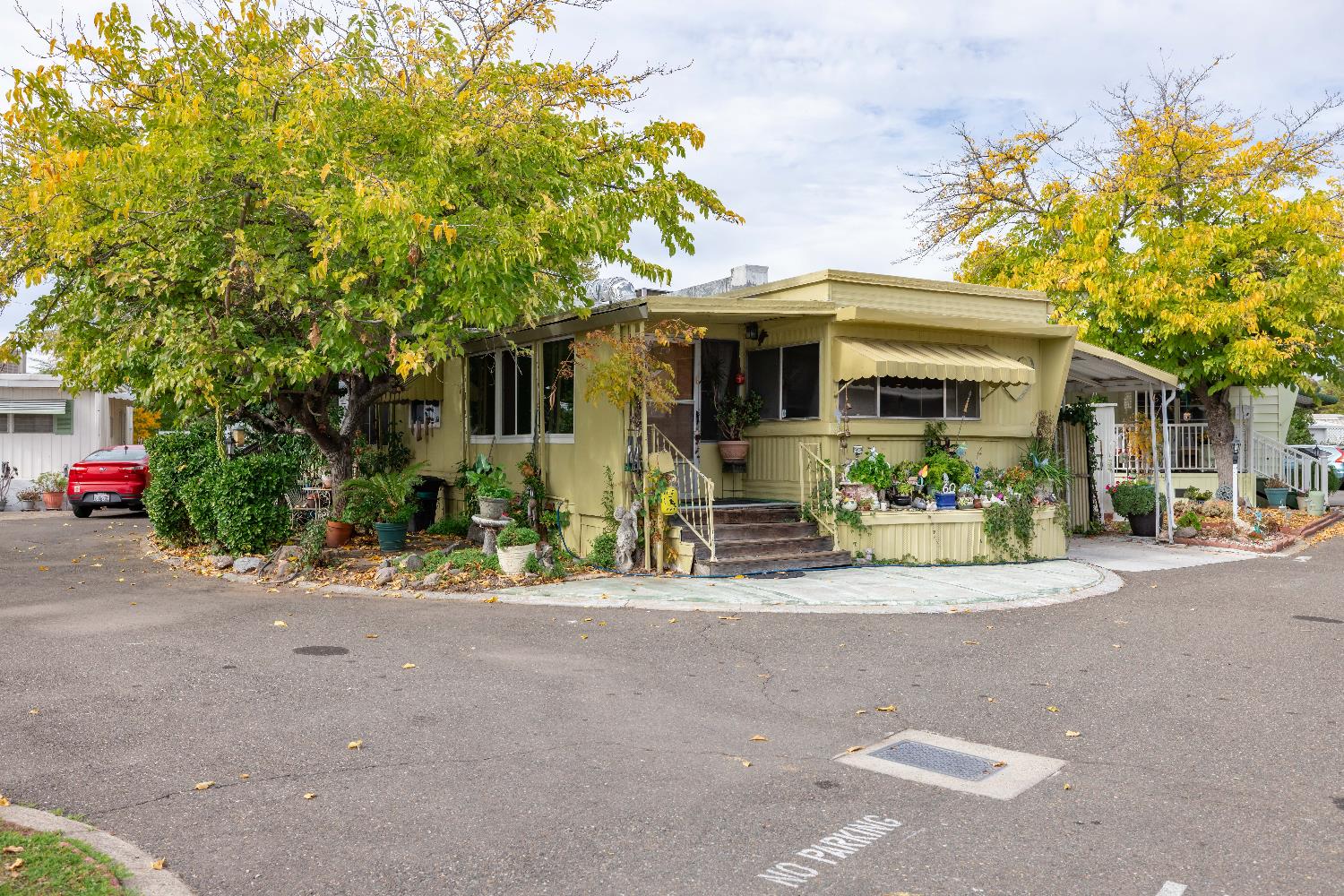 60 Birch Lane Folsom, CA 95630 - Photo 2 of 24 a view of a house with potted plants and large trees