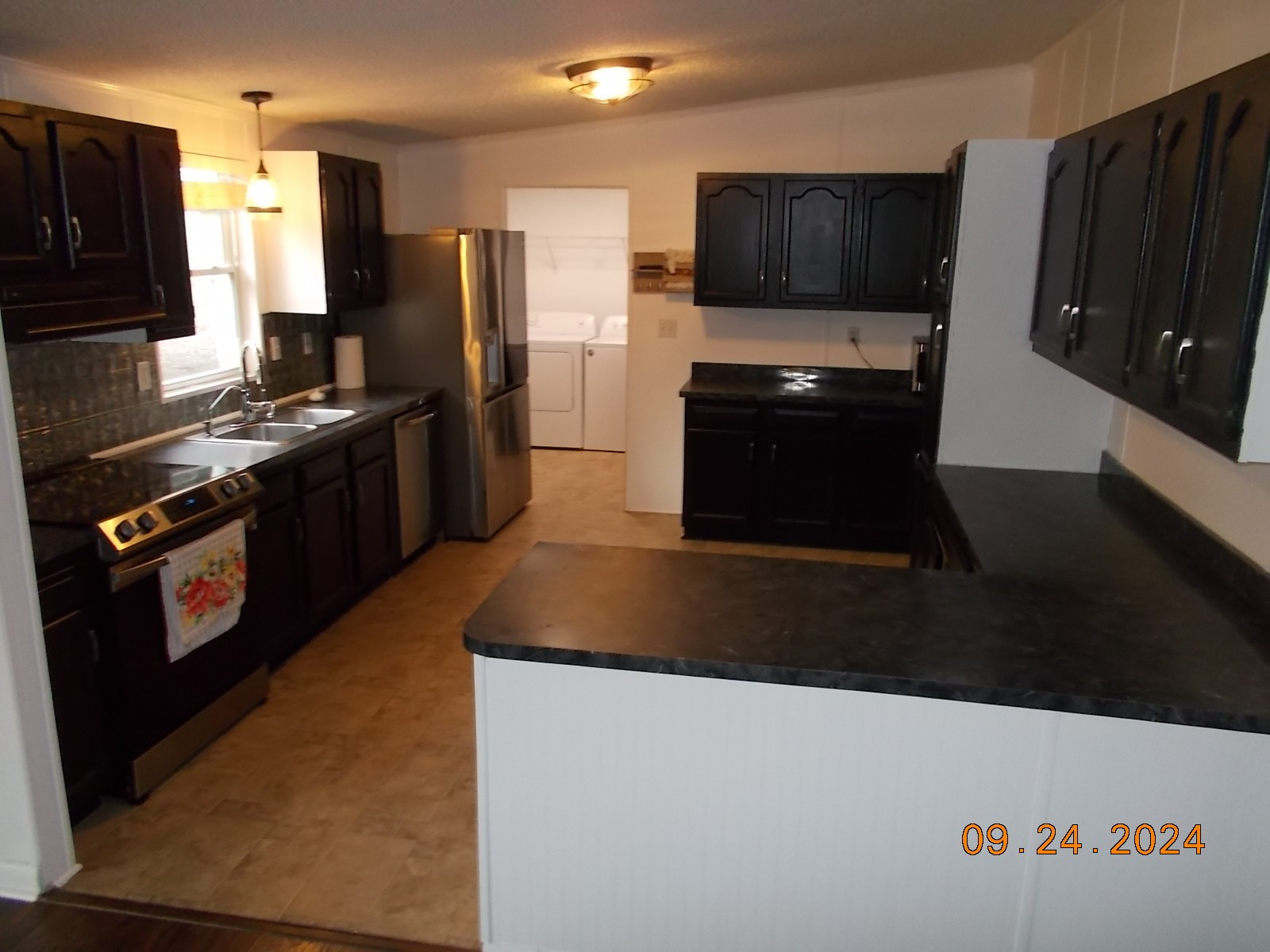 3354 Linwood Road Watertown, TN 37184 - Photo 33 of 54 a kitchen with granite countertop a refrigerator and a stove