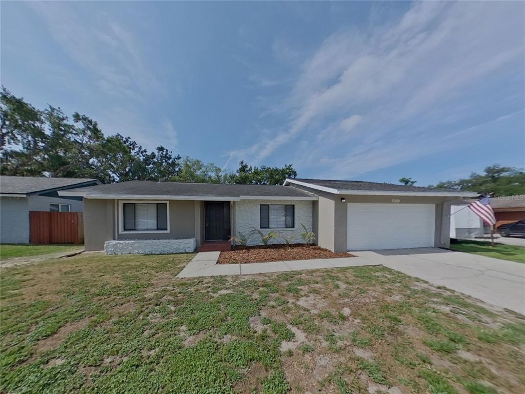 front view of a house with a yard