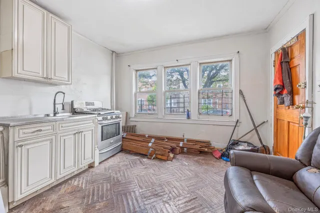 a view of kitchen with furniture and stove