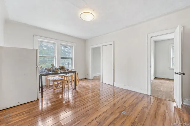 a bathroom with a sink toilet vanity and bathtub