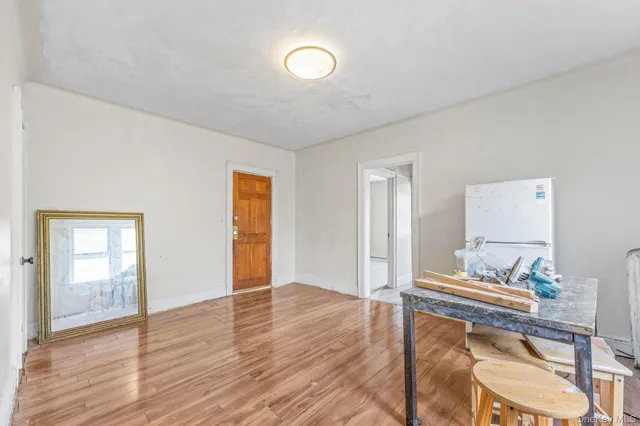 a view of a livingroom with furniture and wooden floor