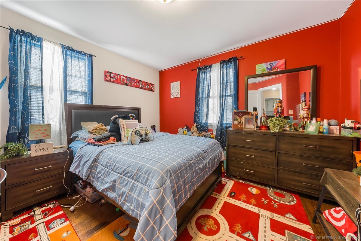 631 Fairview Avenue Bridgeport, CT 06606 - Photo 11 of 22 a bedroom with a bed and window