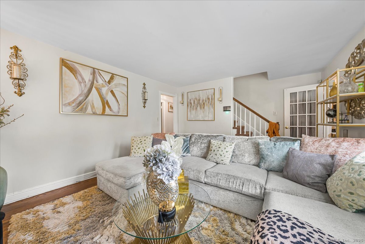 631 Fairview Avenue Bridgeport, CT 06606 - Photo 14 of 22 a living room with furniture and a rug