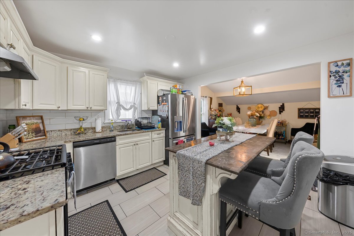 631 Fairview Avenue Bridgeport, CT 06606 - Photo 4 of 22 a kitchen that has a lot of cabinets in it and appliances