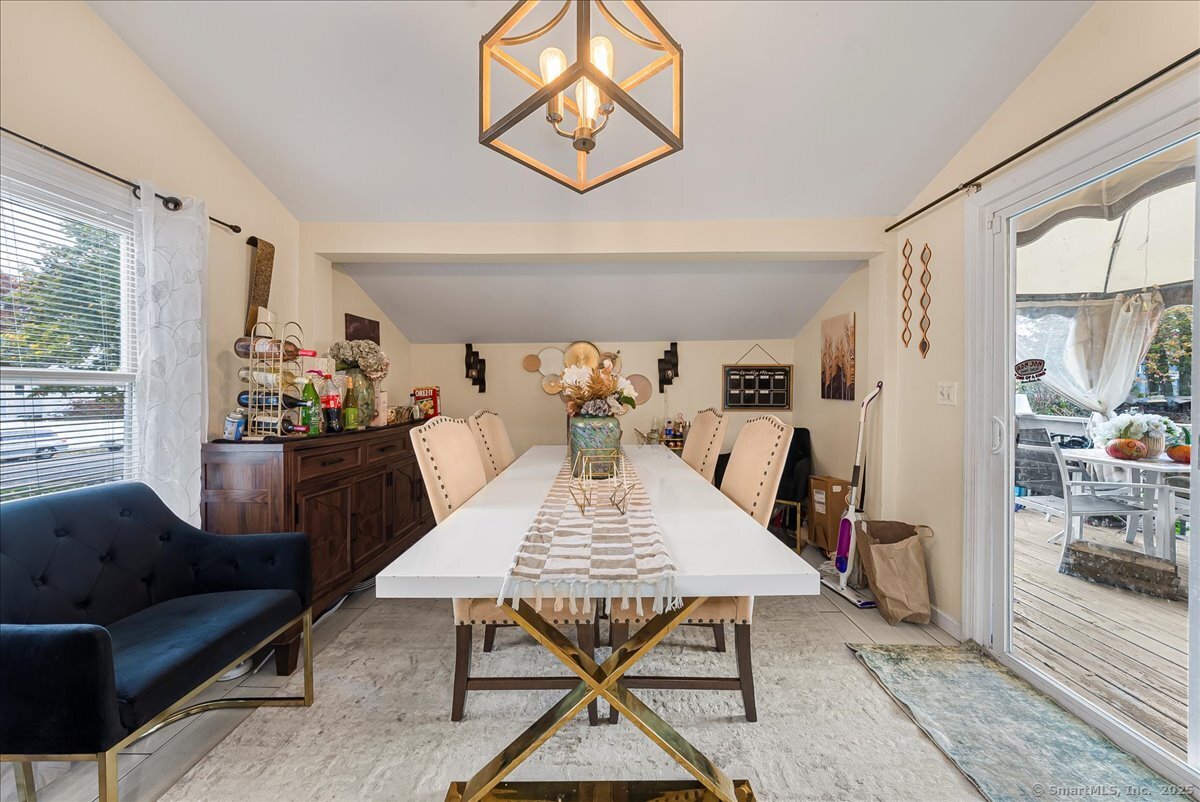 631 Fairview Avenue Bridgeport, CT 06606 - Photo 5 of 22 a view of a dining room with furniture and wooden floor