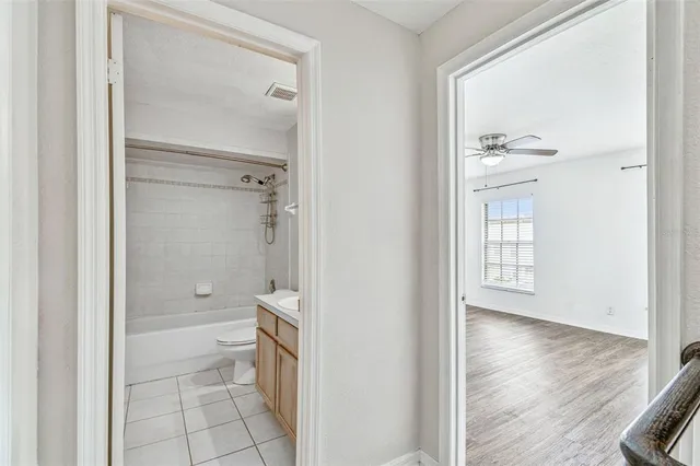 a bathroom with a glass shower door