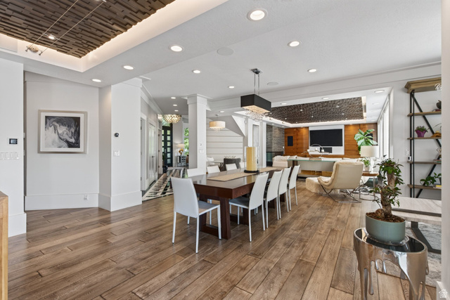 12308 Mariah Circle Draper, UT 84020 - Photo 28 of 293 Spacious open-concept interior featuring wood-finish flooring, recessed lighting, and a textured tray ceiling