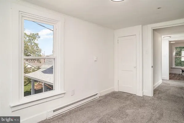a view of an empty room and window