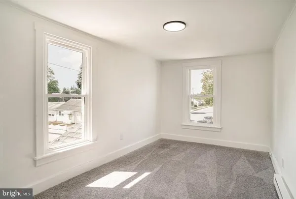 an empty room with windows