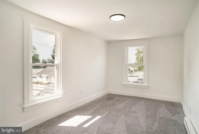 an empty room with windows