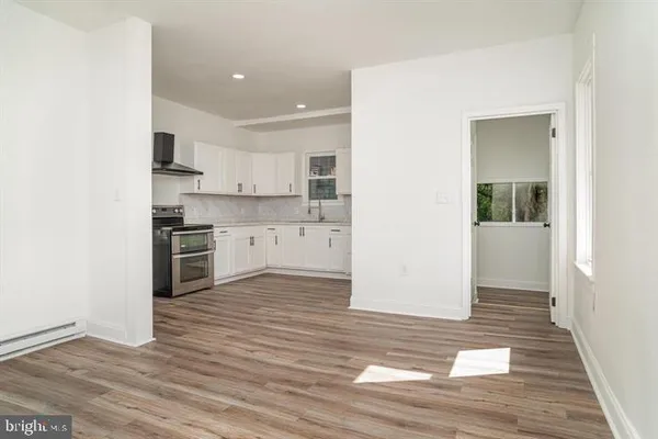 a view of kitchen with wooden floor