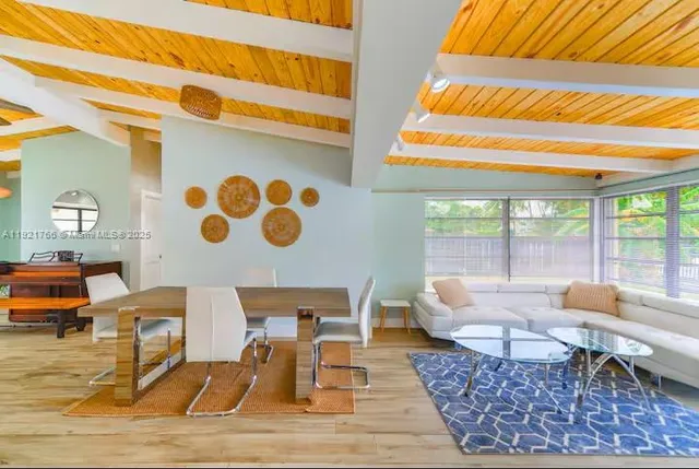a living room with furniture and a table
