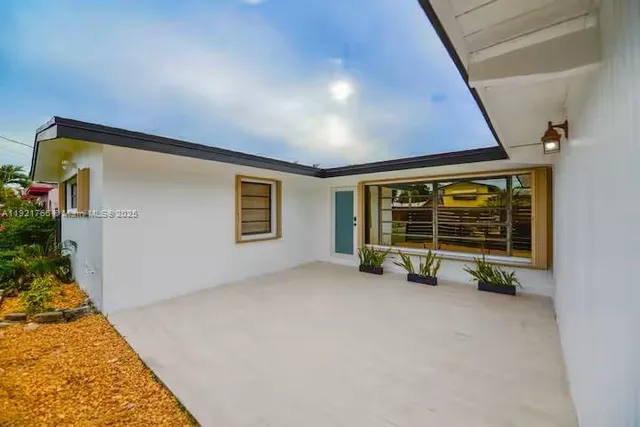 a view of an empty room with a fireplace