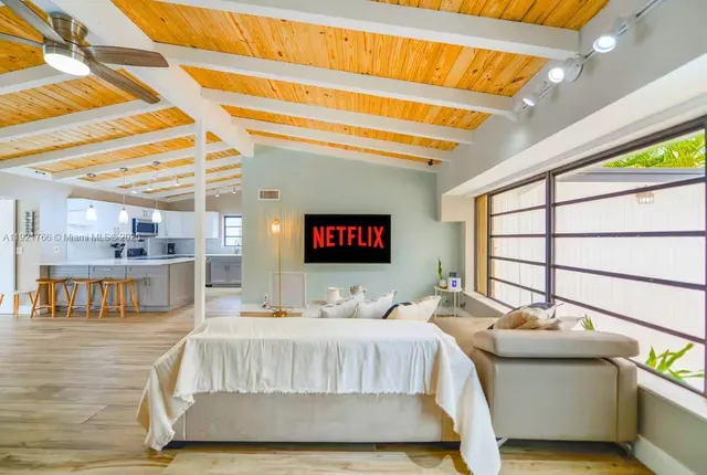 a bedroom with a bed and a night stand