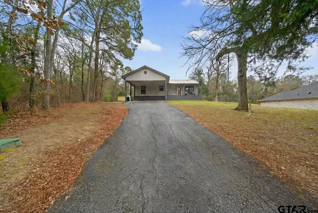 a kitchen with stainless steel appliances granite countertop a refrigerator and a stove