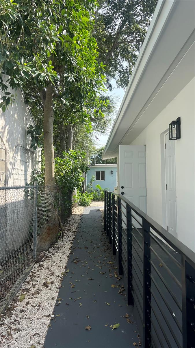 12 Northeast 49th Street, Unit 12 Miami, FL 33137 - Photo 2 of 13 a view of a house with backyard and trees