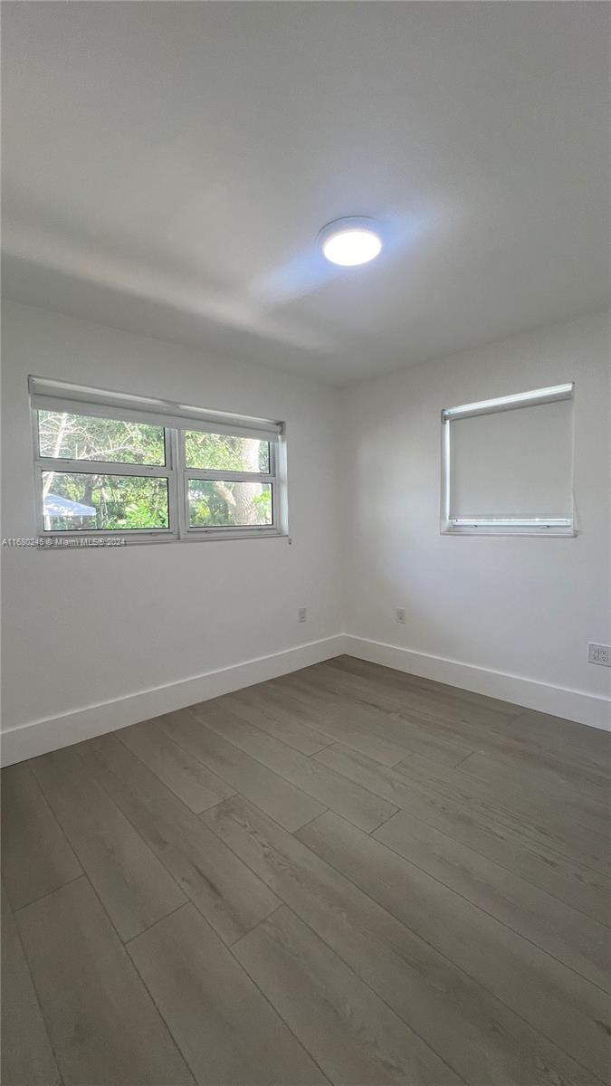 12 Northeast 49th Street, Unit 12 Miami, FL 33137 - Photo 5 of 13 an empty room with a window