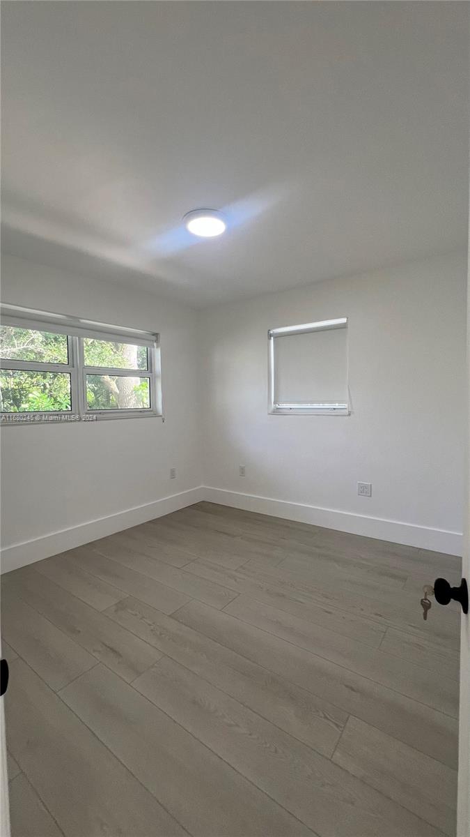 12 Northeast 49th Street, Unit 12 Miami, FL 33137 - Photo 7 of 13 an empty room with a window