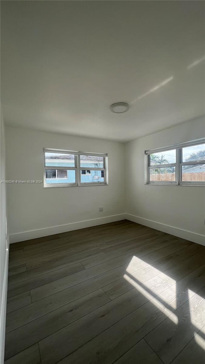 12 Northeast 49th Street, Unit 12 Miami, FL 33137 - Photo 8 of 13 a view of an empty room and window