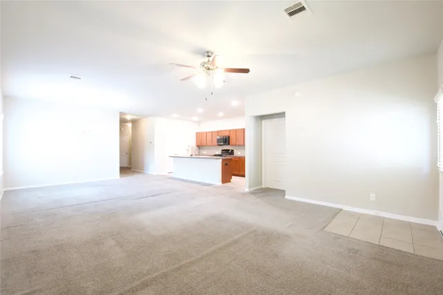 a view of a kitchen with a sink and a window