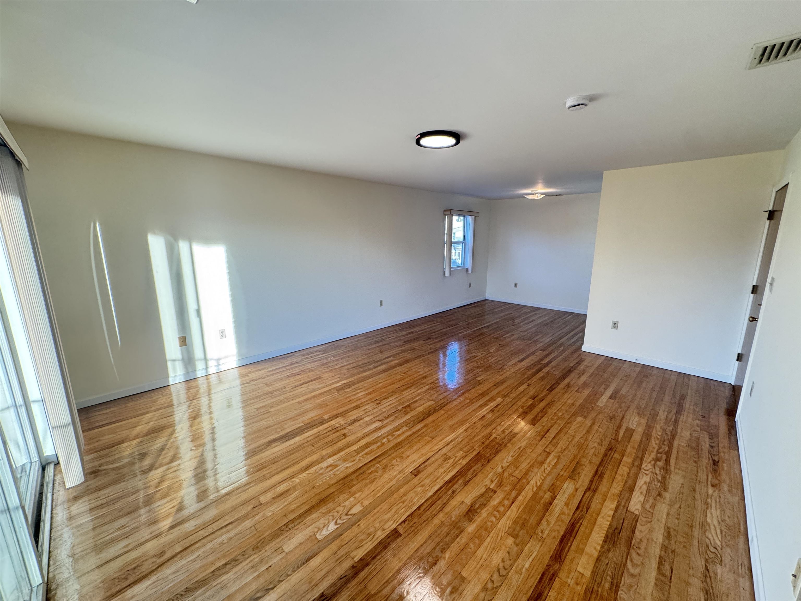 4414 Liberty Avenue, Unit 2 North Bergen, NJ 07047 - Photo 1 of 14 a view of empty room with wooden floor