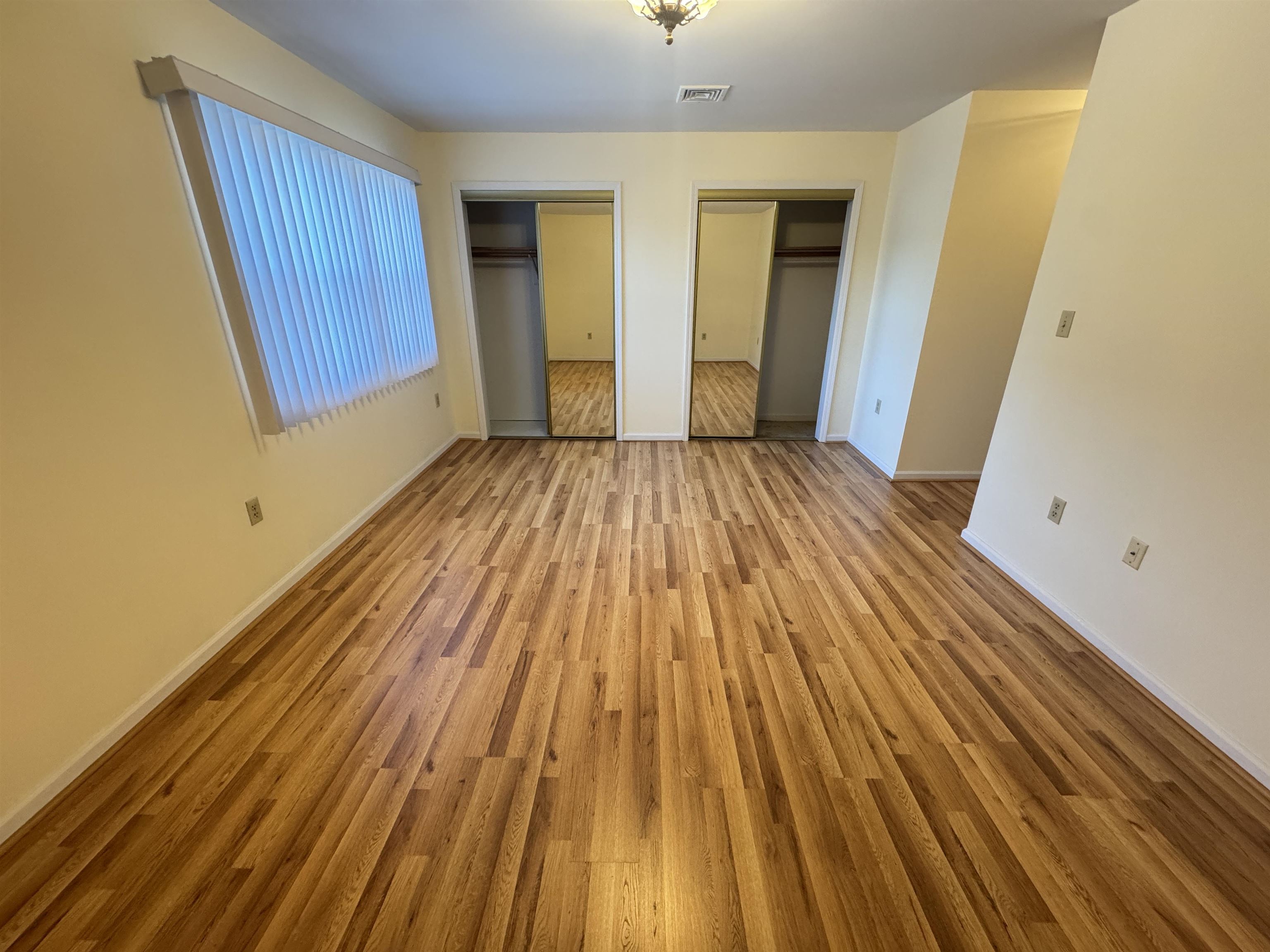 4414 Liberty Avenue, Unit 2 North Bergen, NJ 07047 - Photo 12 of 14 a view of a room with wooden floor and staircase
