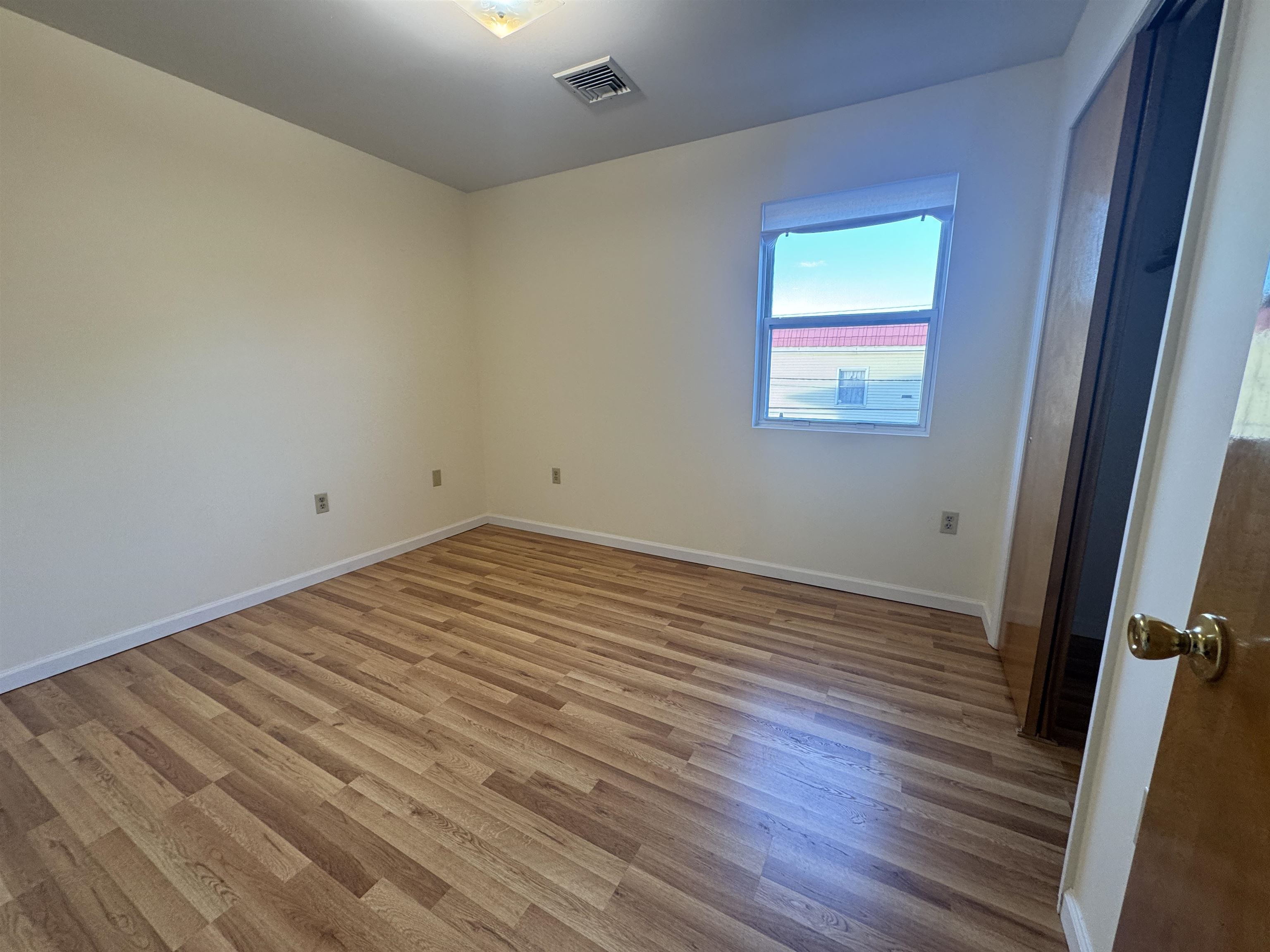 4414 Liberty Avenue, Unit 2 North Bergen, NJ 07047 - Photo 7 of 14 a view of empty room with wooden floor