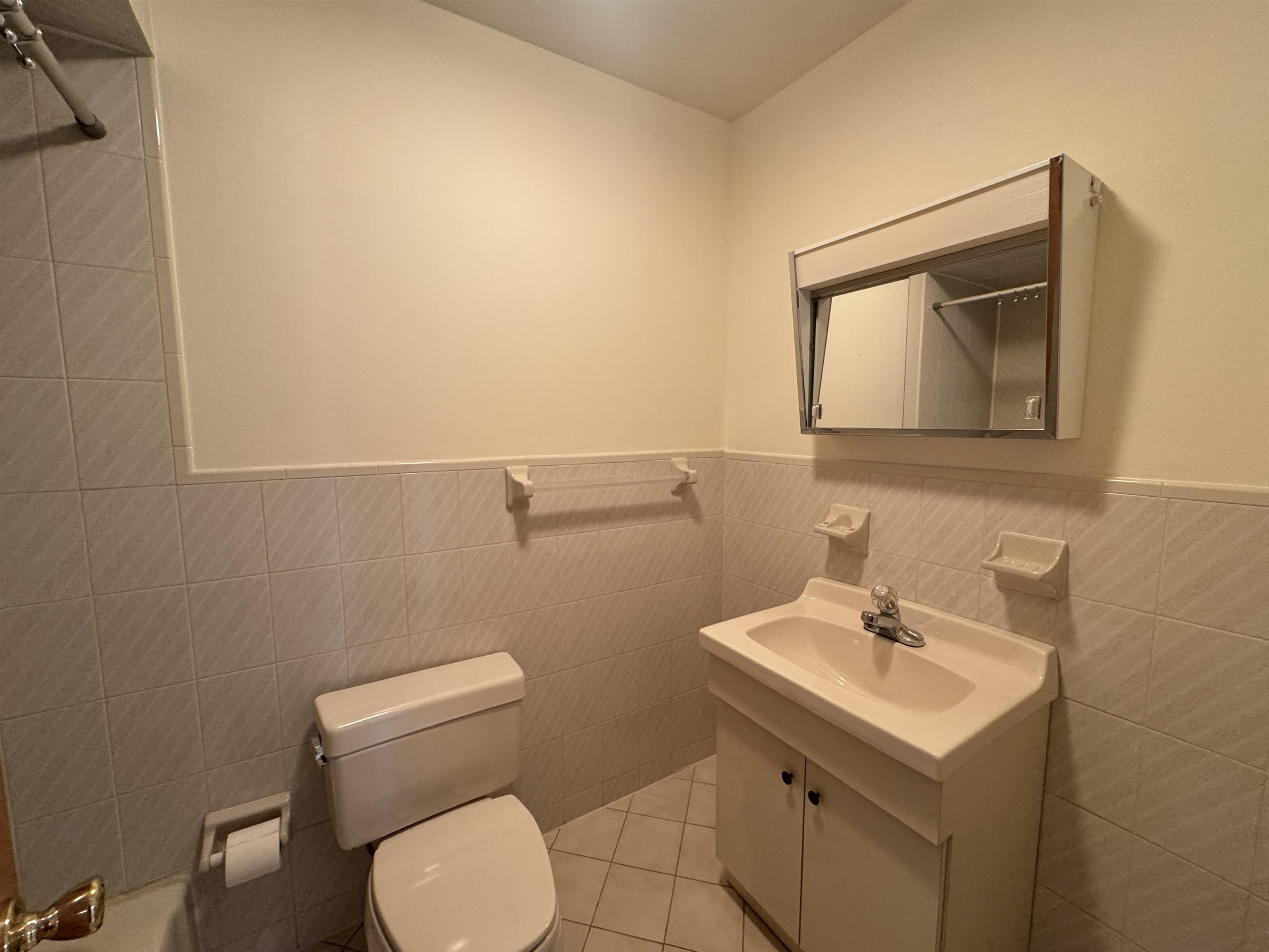 4414 Liberty Avenue, Unit 2 North Bergen, NJ 07047 - Photo 8 of 14 a bathroom with a toilet a sink and mirror