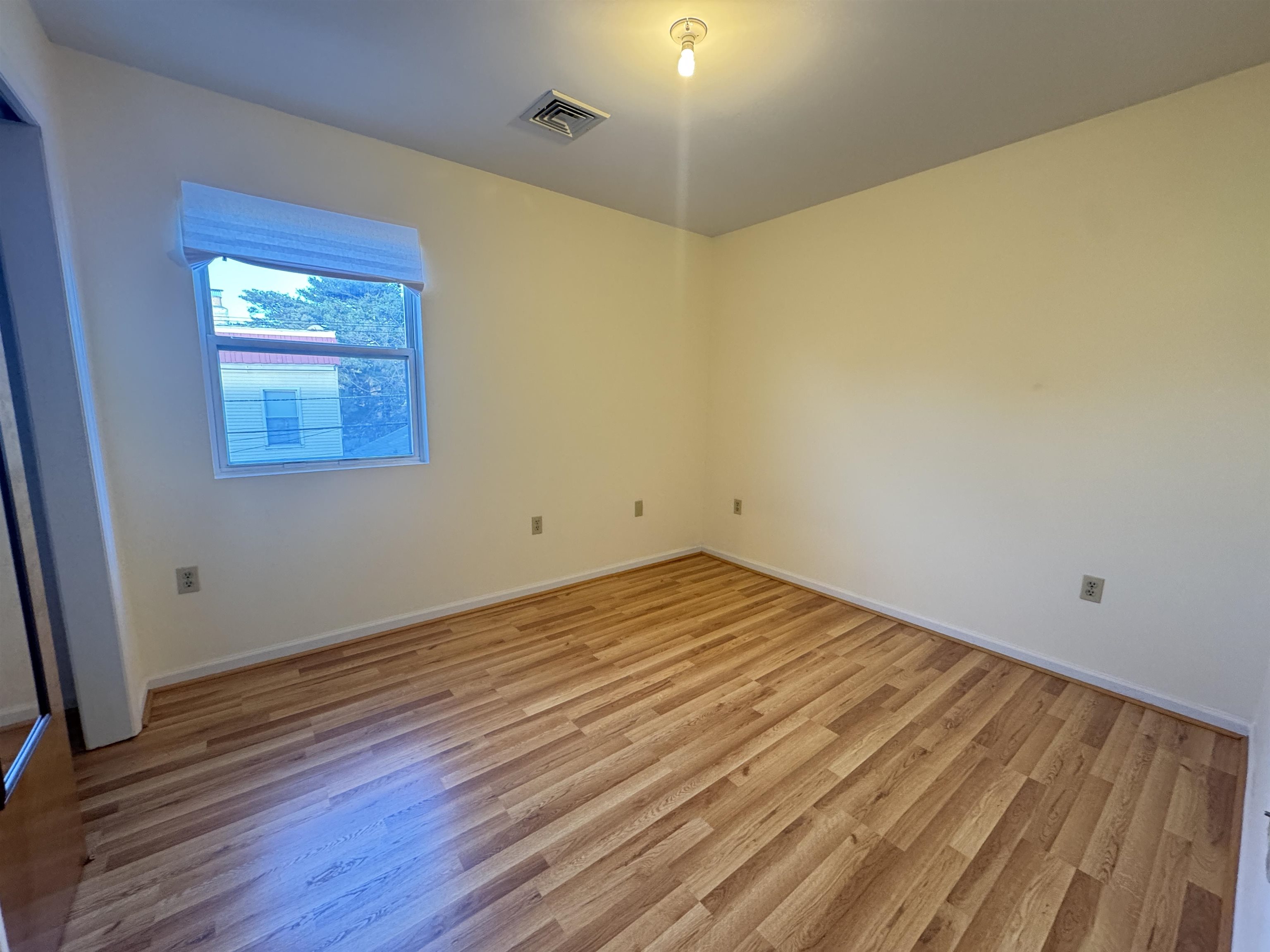 4414 Liberty Avenue, Unit 2 North Bergen, NJ 07047 - Photo 9 of 14 a view of empty room with wooden floor