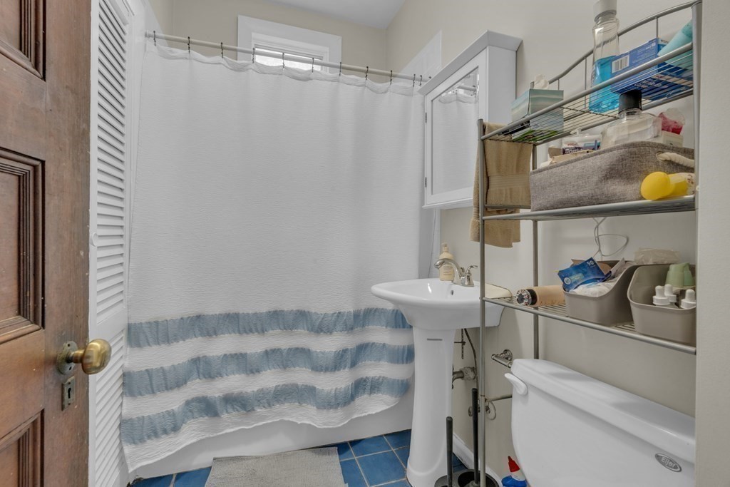 100 Calumet Street Boston, MA 02120 - Photo 17 of 42 a bathroom with a sink toilet and shower