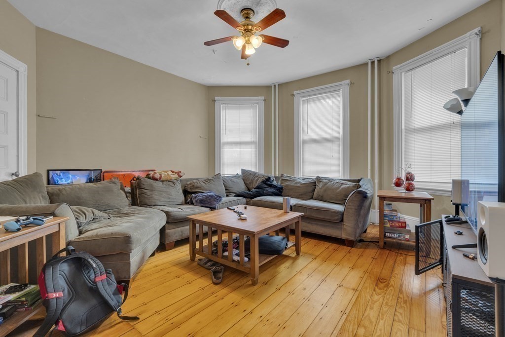 100 Calumet Street Boston, MA 02120 - Photo 21 of 42 a living room with furniture and a wooden floor