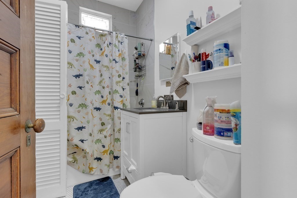 100 Calumet Street Boston, MA 02120 - Photo 25 of 42 a bathroom with a refrigerator and a sink