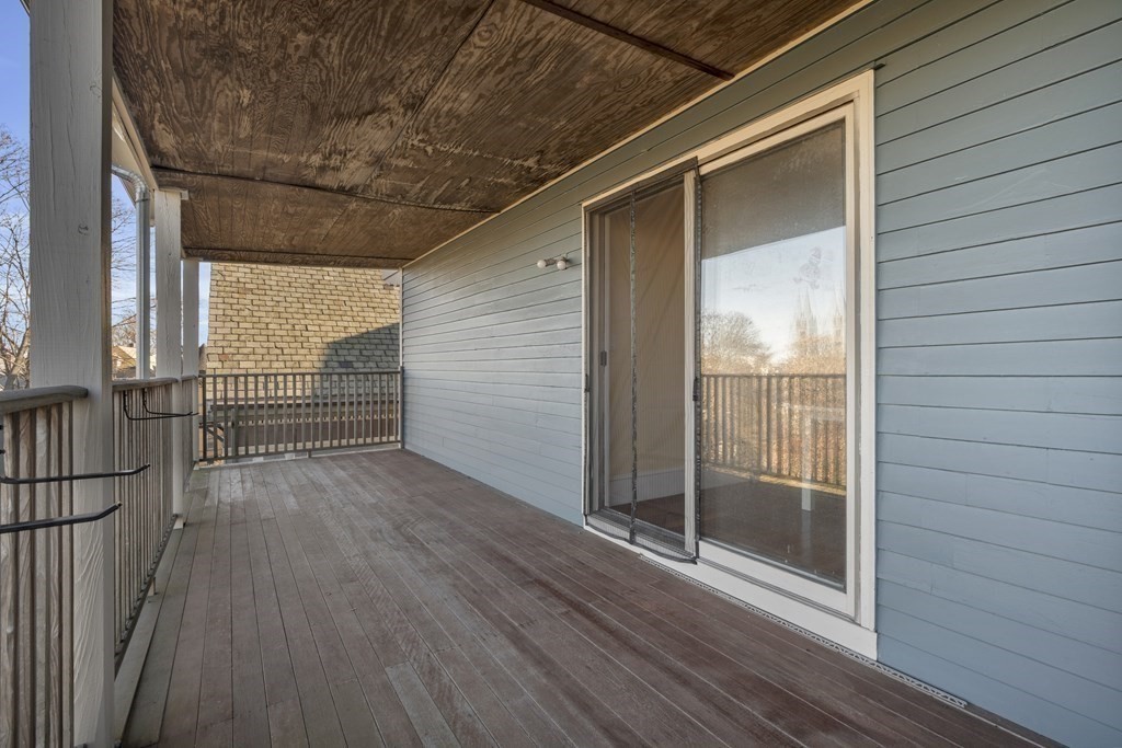 100 Calumet Street Boston, MA 02120 - Photo 30 of 42 a view of a balcony with wooden floor